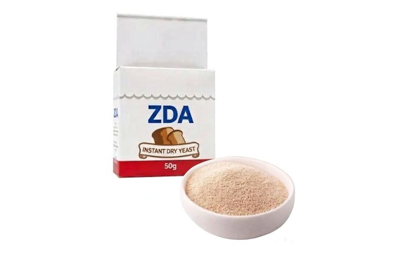 ZDA instant dry yeast retail carton with a bowl of dry yeast